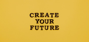 Create your future, schwarzer Text auf gelbem Grund
